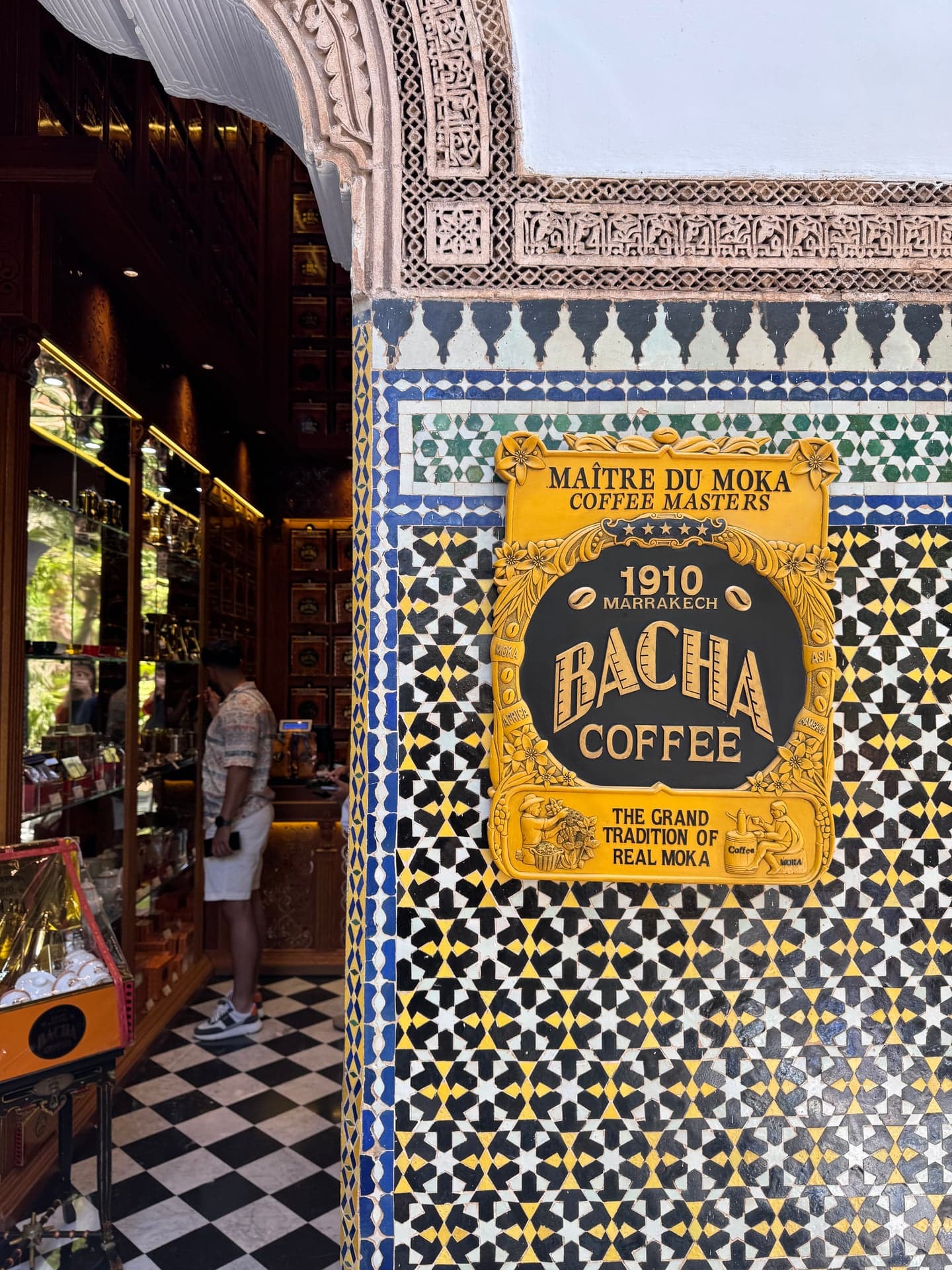The Bacha plaque set on zellige, framing the view into the boutique