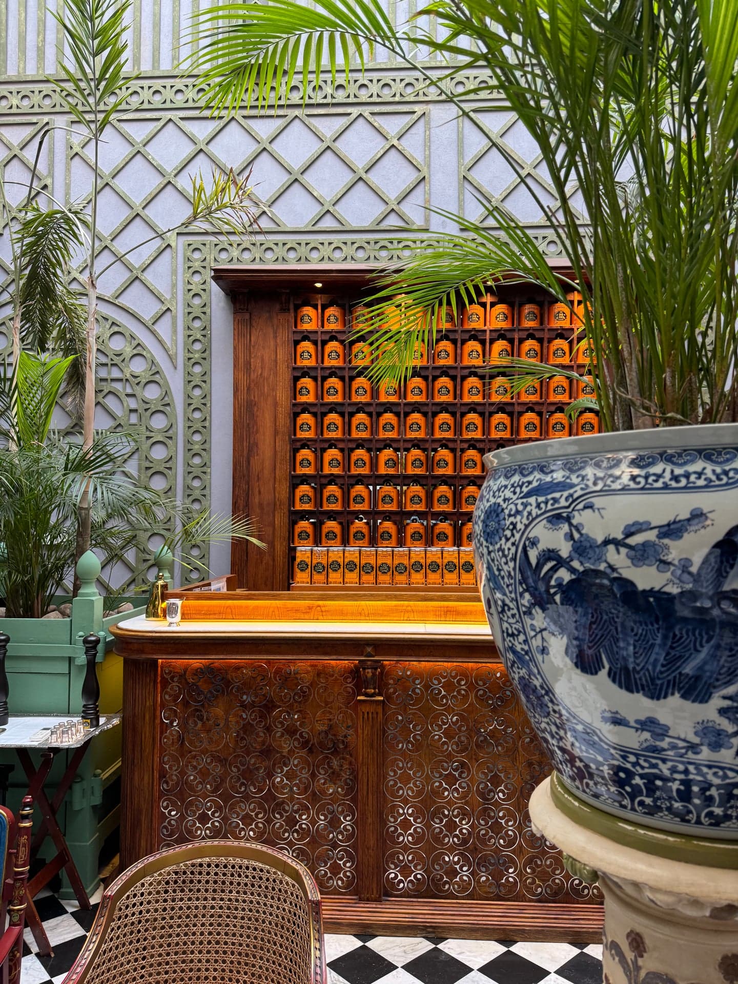 The boutique counter with the wall of tins and the blue-and-white ginger jar
